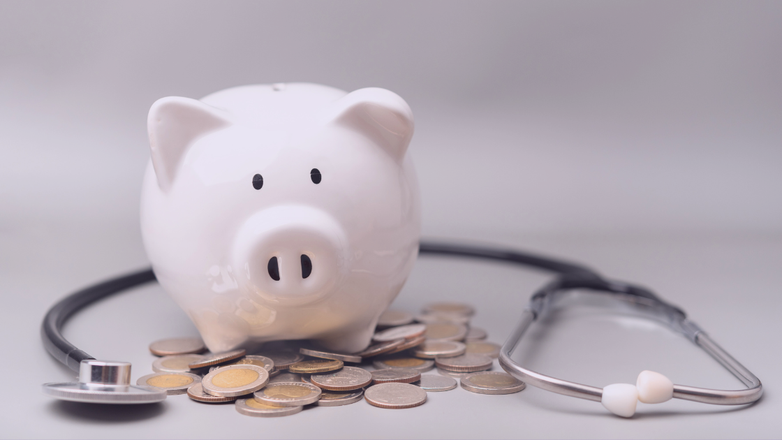 A white piggy bank surrounded by coins and a stethoscope, representing the intersection of medical expenses and financial decisions, hinting at what’s actually tax-deductible under SARS regulations.