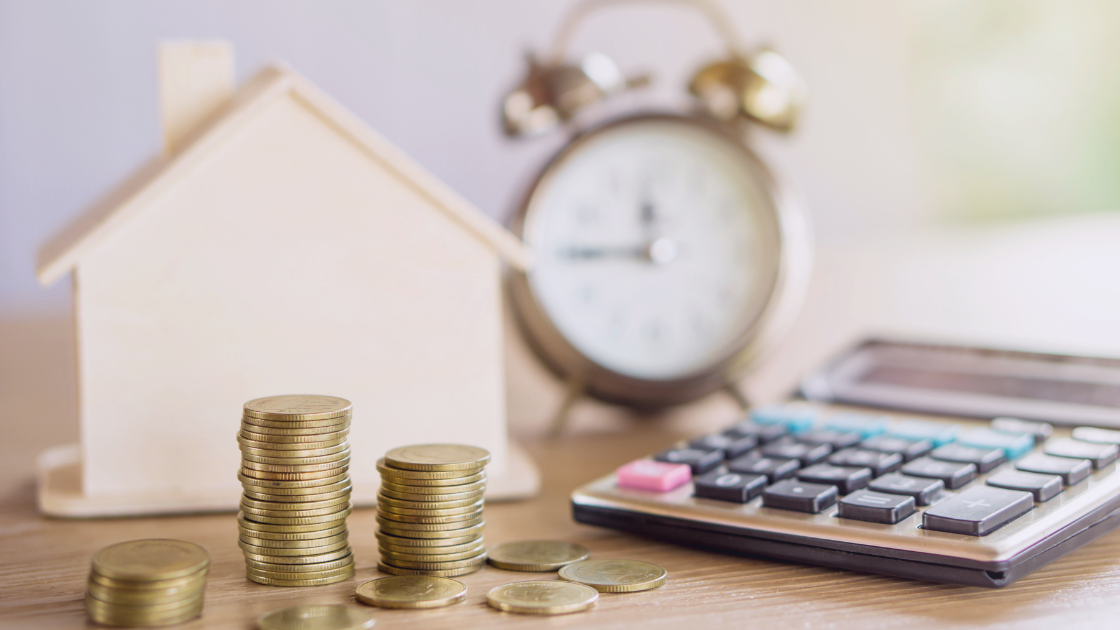 Trusts in South Africa: Tax, Wealth, and Legacy Planning Stacks of gold coins, a house model, a calculator, and a clock symbolizing trust taxation and estate planning in South Africa.